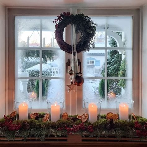 Anna-Lena Lindqvist on Instagram: "View from our kitchen on a frosty day last year (I have also sprayed fake snow on the window here to make It more frosty) I haven't started decorating for Christmas yet this year, there hasn't been time. We came home from Latvia on Sunday evening tired but happy after celebrating my husbands birthday with friends there. Our kids picked us up at the airport and surprised us with a new TV plugged in and ready with all the apps downloaded. Such a great 50th birt Holiday Candle In Window, Christmas Decorations Kitchen Window, Christmas View From Window, Fake Snow Spray Window Ideas, Fake Snow Window Ideas Spray, Snow Spray Window Ideas Diy, Fake Snow On Windows, Snow On Windows Spray Ideas, Christmas Bay Window Decorations