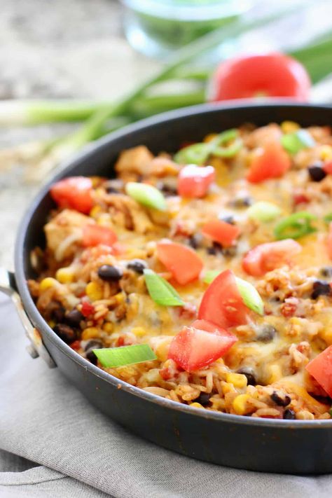 Easy One Pot Mexican Chicken and Rice comes together for a fast a filling dinner! Even the rice goes right into the same pot! Healthy Mexican Casserole, Pot Beans, One Pot Mexican, Mexican Chicken And Rice, Mexican Casserole, Healthy Mexican, Filling Dinner, One Pot Chicken, Mexican Chicken