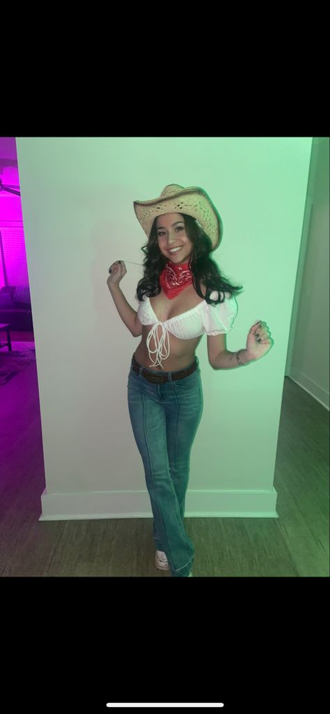 Halloween costume idea, cowgirl! Wearing a white top, flare jeans, red bandana, and cowboy hat! Cowgirl Women Costume, Cowgirl Style Outfits For Halloween, Western Theme Costumes Women, Outfits With White Hats For Women, Cowgirl Inspo Halloween, Flare Jean Cowgirl Outfit, Cute Cowboy Halloween Costume, Flare Jeans Cowgirl Outfit, Cowgirl Outfit With Bandana