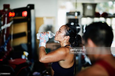 Stock Photo : Sweating female boxer drinking water after workout in boxing gym Woman Boxing, Gym Schedule, Female Boxer, Gym Photography, Sports Recovery, Female Boxers, Boxing Gym, Partner Workout, Benefits Of Exercise