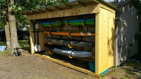 Kayak and paddle board shed Canoe Shed Storage, Garage Paddle Board Storage, Surfboard Storage Shed, Kayak And Paddle Board Storage, Paddle Board Storage Diy, Lake Shed Storage Ideas, Outdoor Kayak Storage Diy, Kayak Paddle Storage, Kayak Racks For Storage