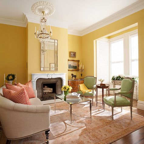 Bathed in light from the bay window, buttery yellow walls keep the large space from becoming too formal while putting the focus on the confection of period details. Yellow Living Room Colors, Yellow Walls Living Room, Yellow Decor Living Room, Furnitur Ruang Keluarga, Yellow Room, Yellow Living Room, Living Room Color Schemes, Yellow Decor, Trendy Living Rooms