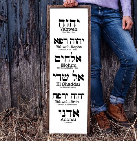 "Yahweh, Yahweh-Rapha, Elohim, El Shaddai, Yahweh-Jireh, and Adonai Wall Sign Decor is a visual reminder of the names of God. This piece would be a meaningful gift or a great wall decor for your house or prayer room. It is made of wood with a design made of vinyl. The frame is stained in a dark walnut color. You can choose between white and black. Measurements: H 36\" x W12\" Every sign we create is custom-made. Some parts may have knots, blemishes, or different grain patterns as each piece of w El Shaddai Hebrew, Yahweh Rapha Tattoo, Yahweh Rapha Elohim Shaddai Jireh Adonai, Yahweh Rapha, Apartment Construction, Wall Sign Decor, The Names Of God, Tiny Library, Prayer Room Ideas