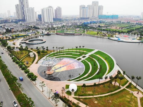 Astronomy Park is a public park project in Hanoi. The project is located in a new development area in the West of the city and is Vietnam’s first astronomy park. Construction project surrounds Bach Hop Thuy lake, an abandoned detention basin of Duong Noi urban area. This project is a boost to the real estate while also significantly improving the quality of life and public space in the new district of Hanoi. Lake Park Design, Bach Hop, Public Park Design, City Parks Design, Park Concept, Eco Park, Park Project, Water Playground, Desain Lanskap