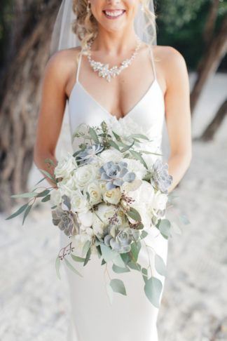 I wanted a very natural-looking bouquet – all white florals with lots of greenery throughout for our Key Largo wedding. I included seeded eucalyptus and succulents., along with white hydrangeas and roses. Bridesmaids With Different Bouquets, Modern Wedding Bouquets, Hydrangea Bouquet Wedding, Succulent Bouquet Wedding, Cascading Wedding Bouquets, Winter Wedding Bouquet, Summer Wedding Bouquets, White Hydrangeas, Succulent Bouquet