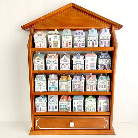 Collectible, adorable and highly sought-after spice jars and matching wooden display rack from The Lenox Spice Village collection from 1989. Each jar is made of fine porcelain, handcrafted in Taiwan. They are all marked on the bottom in golden font and some of the jars even have their original sticker on the bottom as well (see photo with bottoms displayed). The inside of each lid is marked with the type of spice! The lids also have a rubber stopper so that they sit nicely on the jar and keep it airtight. PLEASE NOTE: this listing is to purchase ONE (1) spice jar. Please select which spice jar you would like to purchase from the dropdown menu. If you would like to purchase more than one, please add each individual spice jar to your cart. A small combined shipping discount will be provided Lenox Spice Village, Spice Village, Wooden Spice Rack, Spice Containers, Wooden Display, Spice Organization, Kitchen Jars Storage, Display Rack, Canister Sets