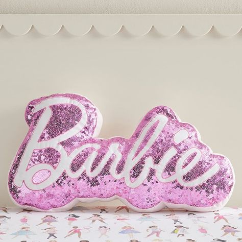 For a touch of shine to their space, add this plush Barbie(TM) pillow! With pink sequins and signature Barbie lettering, this shimmery piece adds fun flair to any chair or bed. DETAILS THAT MATTER Pillow is made from 100% cotton sateen. Cotton sateen is known for its luxurious sheen while providing supreme softness and ultra durability. Reverses to a 100% yarn-dyed cotton percale with a solid pattern. Yarn-dyed fiber has incredibly rich color that holds its vibrancy over time. Pillow is filled w Barbie Lettering, Barbie Room Decor, Hot Pink Room, Glitter Room, Tm Logo, Barbie Bedroom, Hello Kitty Bedroom, Barbie Room, Barbie Logo