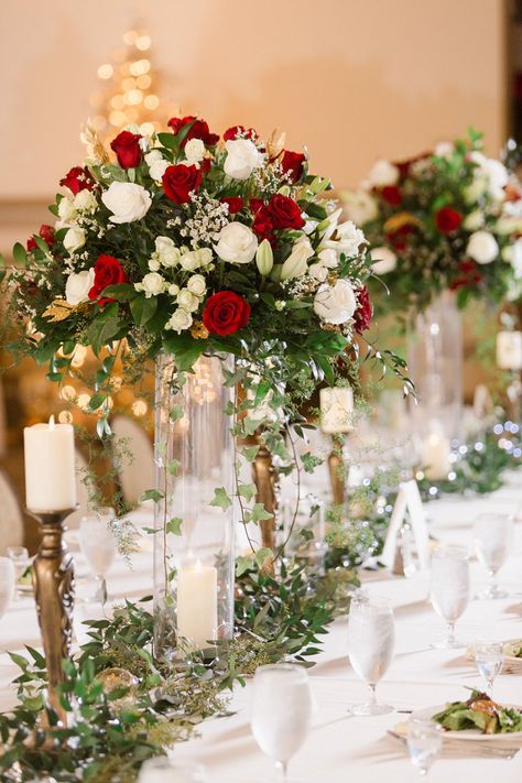 Rose Flower Arrangements Wedding, Red Winter Wedding Centerpieces, Y’all Centerpieces, Crimson And White Wedding, Red Rose Wedding Reception Decor, Red Rose Centrepiece Wedding, Red White Green Wedding Decorations, Red Tall Centerpieces, Classic Wedding Flower Arrangements