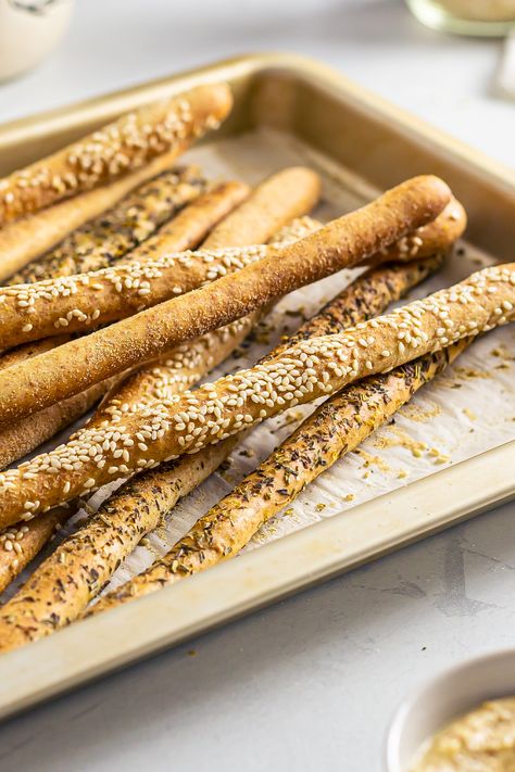 a tray with sourdough breadsticks Uses For Sourdough Starter Discard, Sourdough Discard Grissini, Sourdough Grissini Recipe, Sour Dough Bread Sticks, Quick Sourdough Discard Recipes Crackers, Sourdough Breadsticks Discard, Grissini Breadsticks Recipe, Sourdough Discard Breadsticks Recipe, Sourdough Bread Sticks Recipe