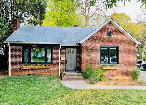 Black Windows Modernize Red Brick Home | Pella North Carolina Pella Impervia Windows, Black Windows Exterior, Farmhouse Exterior Paint Colors, Painted Window Frames, Bifold Patio Doors, Framed Windows, Fiberglass Windows, Dark Windows, Brick Ranch