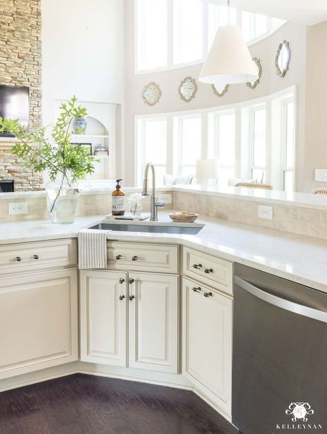 How to update and make a traditional kitchen with cream cabinets more modern and current (without painting the cabinets!) #kitchenideas #creamkitchen #creamcabinets #quartz #marble #counters #countertop #kitchencounter #kitchenisland  #kitchenmakeover #transitionalkitchen #classickitchen Cream Cabinets With White Quartz Countertops, Soprano Quartz Countertops, Cream Cabinets With Quartz Countertops, Viatera Soprano Quartz Countertops, Quartz Countertops With Off White Cabinets, Alabaster White Quartz Countertops, Cream Quartz Countertops Kitchen, Quartz Countertops With Cream Cabinets, Cream Kitchen Cabinets With Quartz