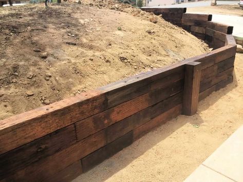 Where To Buy Railroad Ties For Sale in 2022 -The Ultimate Guide Rail Road Ties Retaining Wall, Railroad Ties Retaining Wall Ideas, Railroad Ties Landscaping, Railroad Tie Retaining Wall, Retaining Wall Patio, Farm Landscaping, Retaining Wall Ideas, Railroad Tie, Retaining Wall Design