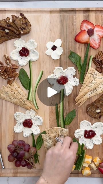 mama • lawyer • entrepreneur • creator on Instagram: "FLORAL CHEESE PLATTER 🌸🧀  Bringing a taste of spring to the table with this flower cheese board! 🧀💐 I had so much fun making this for lunch when we had family over. It’s perfect for the season and a sweet idea for Mother’s Day! You can use any soft cheese, I used creamy @boursincheese for the petals, with a jam center; strawberries for the red petals, and bocconcini slices for the white flower on top. Crisp cucumber stems and fragrant basil leaves complete the garden-inspired display, sprinkled with nuts, grapes, cheeses and crackers.   SAVE FOR MOTHERS DAY ✨💫  Inspo from: @maxistories . . . . #cheeseboard #cheeseplatter #eatpretty #foodart #fooddesign #mothersdayideas" Flower Cheese Board, Easy Casserole Dishes, Cheese Table, Eat Pretty, White Cheese, Cheese Tray, Cheese Platter, Red Petals, Snack Attack