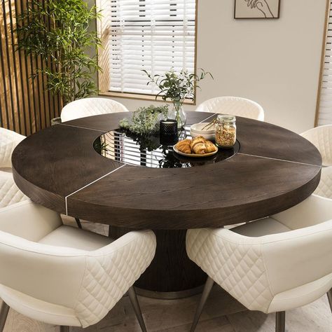 Infuse your dining space with a burst of bold style, blending the social allure of a round dining table with the opulence of luxury dining chairs. This modern 6 chair dining set combines six white premium faux leather dining chairs with a round dark elm table, with a lazy susan, that captivates with its stylish charm. This stunning round dining table will effortlessly seat 6 guests. For added convenience, the rotating lazy susan with LED lighting makes for a fun dining experience. Sleek in design, the dark elm veneer dining table has a round 160cm top supported by a surdy pedestal base that adds stability for years of enjoyment. Including Lucy carver dining room chairs with arms, a wrap-around backrest, and a curved outline. The backrest gracefully curves upward, creating a timeless modern Veneer Dining Table, Luxury Dining Chairs, Corner Dining Bench, Corner Bench Dining Set, Round Table And Chairs, Round Dining Room Table, 6 Seater Dining Table, Corner Dining Set, Luxury Dining Chair