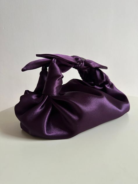 Small satin plum woman bag with knots. Stylish small handmade bag that is suitable for any occasion. Furoshiki knot bag is soft, closes with a magnetic button. This japanese knot bag is made in vintage style, based on the japanese technigue of tying a silk scarf in a knot. Elegant woman bag is very roomy - fits a phone, wallet, keys, makeup. Perfect wedding purse. Fashion handbag can be sewn from satin or velvet. I have a huge selection of colors, more than indicated in the listing. Please write Tying A Silk Scarf, Bag Origami, Satin Handbag, Japanese Knot, Chicago Outfit, Satin Purses, Origami Bag, Japanese Knot Bag, Knot Bag