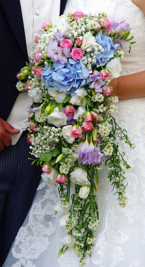 A cascading wedding bouquet in pastel colours at Blake Hall Cascading Pastel Bridal Bouquet, Flower Cascade, Pastel Bridal Bouquet, Lavender Bridal Bouquet, Bouquet Colorful, Elegant Bridal Bouquets, Cascading Bridal Bouquets, Cascading Wedding Bouquets, Button Holes Wedding