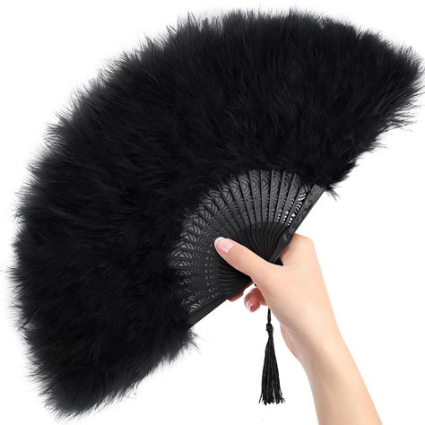 PRICES MAY VARY. Versatile Applications - From weddings and dance performances to tea parties and masquerade balls, these feather hand fans are the perfect accessory for any occasion. Their versatility extends to serving as stunning room decorations and captivating photo props, adding a touch of elegance to any setting. Exquisite Design - Enhanced by delicate tassels, these fans boast a lively aesthetic that is sure to turn heads and make you the center of attention wherever you go. Natural & Hy Victorian Masquerade Ball Decorations, Roaring 20s Backdrop, Masquerade Ball Table Decorations, Phantom Of The Opera Party Decorations, Black Party Aesthetic, 1920 Party Decorations, Black Tie Party Decorations, Hand Fan Aesthetic, Dark Party Decor