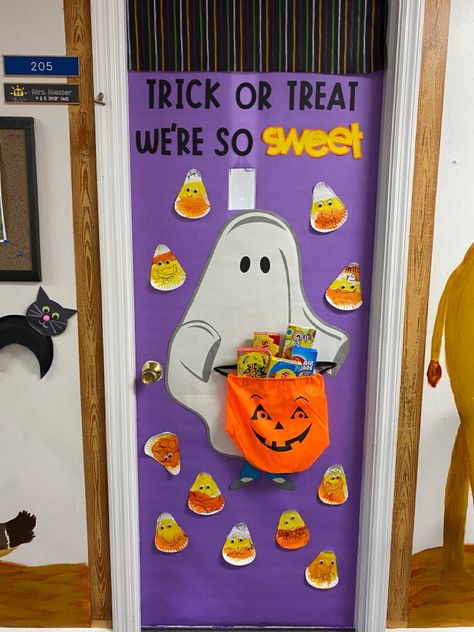 Kiddos made their own candy corn pieces to decorate our classroom door for Halloween. Candy Corn Door Classroom, Halloween Door Design Classroom, Candy Corn Door Decoration, Halloween Decorated Doors Ideas, Candy Corn Bulletin Board Ideas, Disney Halloween Door, October Classroom Door Ideas, Lavender Classroom, Halloween Classroom Door Ideas