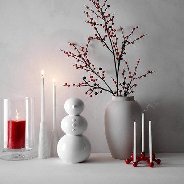 You can deck out the indoors and outdoors with wreaths, garlands, and more to help spread the holiday cheer. Scroll through for the best places to buy holiday decorations online. #hunkerhome #holidaydecorations #holiday #holidaydecor #holidays Modern Minimalist Christmas Decor, Minimalist Holiday Decor, Christmas Candle Centerpiece, Red Coats, Red Centerpieces, Ceramic Snowman, Faux Branches, Scented Pillar Candles, Winter Decorations