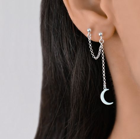 This double piercing chain earring has 2 stud earrings connected by a dangly chain. There is a moon charm on the one stud. The earring is made of sterling silver 925 that can be gold plated or rose gold plated. This is one earring not a pair of earrings. Earring For 3 Holes, Silver Earrings 2 Holes, Earring Combinations Double, Double Piercing Chain Earrings, Silver Earring Inspiration, Cute Earrings Aesthetic Silver, Earrings For 2 Piercings, Double Earring Ideas, Ear Piercings 2 Holes