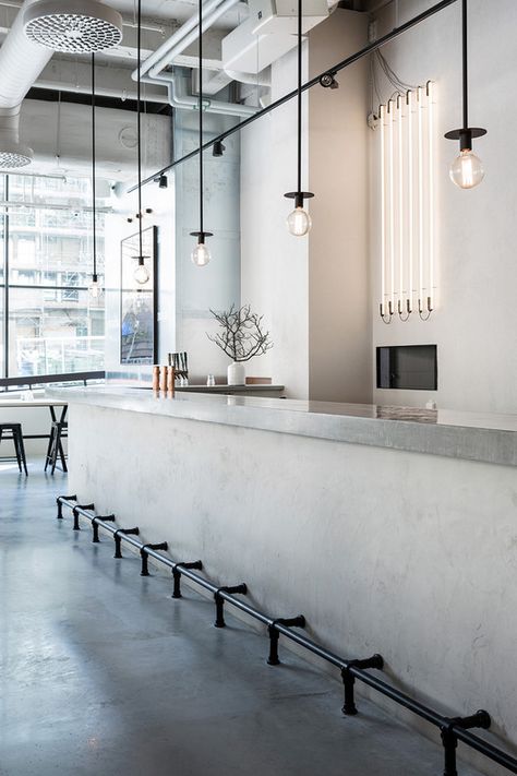 CATADOS - Mauricio Menezes  -  #mnz   -   concrete bar, neat pendant lights, also fluorescent line lights in back - love! Courtesy of Richard Lindvall Butik Design, Concrete Bar, Minimalist Dekor, Decoration Restaurant, Minimal Interior Design, 카페 인테리어 디자인, Restaurant Concept, Bar Interior, Cafe Interior Design