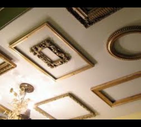 Putting picture frames on the ceiling! Picture Frame Ceiling, Pictures On Ceiling, Decor Hanging From Ceiling, Empty Frames On Wall Decor Ideas, Hanging Art From Ceiling, Empty Frames Decor, Frame By Frame, Coffee Room, Empty Frames