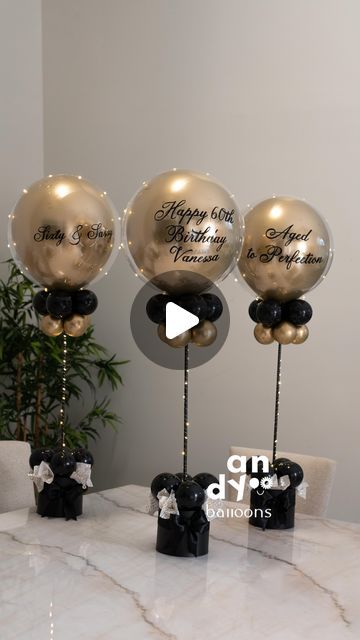 Andy Balloons - Broward FL on Instagram: "Watch how we transform balloons into fabulous centerpieces with lights! ✨  Link in bio for orders!  #balloonsdecor #partydecormiami #centerpiecesideas #diyballoon" 45 Birthday Decoration Ideas, 100th Birthday Centerpieces, Balloon Centrepiece Ideas, 60th Balloon Bouquet, Picture And Balloon Centerpieces, Retirement Centerpieces Men, Diy Grad Party Centerpieces, Ballon Table Centerpiece Diy, Table Ballons Decoration