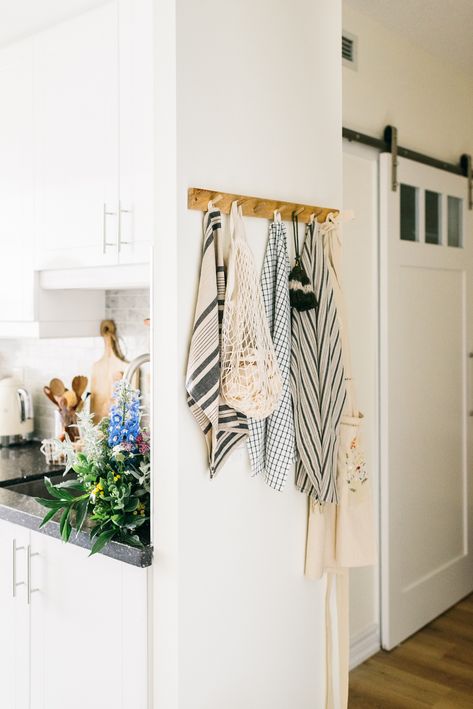 I love peg hooks, they save space and they create an apportunity to style a corner that may have been over looked. Apron Storage Kitchen, Pantry Hook Ideas, Wall Hooks In Kitchen, Hanging Hooks In Kitchen, Kitchen Apron Hanging Ideas, Hooks On Side Of Kitchen Cabinet, Peg Hooks Kitchen, Apron Hooks In Kitchen, Kitchen Hooks Decor