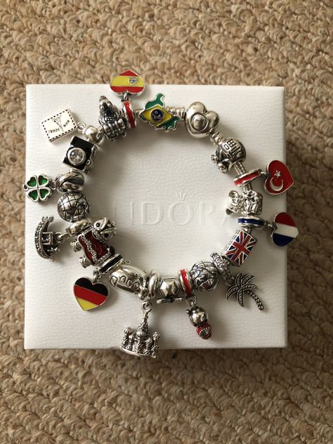 PANDORA wanderlust travel charms and pandora silver heart clasp moments bracelet Finally completed collecting country flag charms and building charms really pleased with the end result 👍🏼 Pandora Bracelet Travel Theme, Pandora Travel Bracelet Ideas, Pandora Moments Bracelet Ideas, Pandora Travel Bracelet, Pandora Bracelet Charms Ideas Silver, Travel Pandora, Pandora Travel Charms, Pandora Travel, Charm Bracelet Pandora