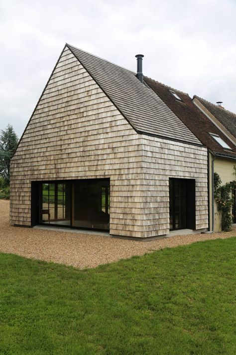 WAW Architectes · EXTENSION OF A LIVING SPACE Shingle House, Hidden House, House Cladding, Shingle Exterior, Wood Shingles, Cedar Shingles, Cottage In The Woods, Timber Cladding, Exterior Cladding