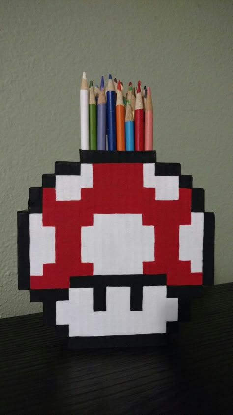 8 bit pixel art Mario mushroom pencil holder made from cardboard and cereal boxes Pixel Art Mario, 8 Bit Pixel Art, Gamer Baby, Diy Pencil Holder, Geek Diy, Ideas Regalos, Diy Room Decor For Teens, Pencil Holders, Cereal Boxes