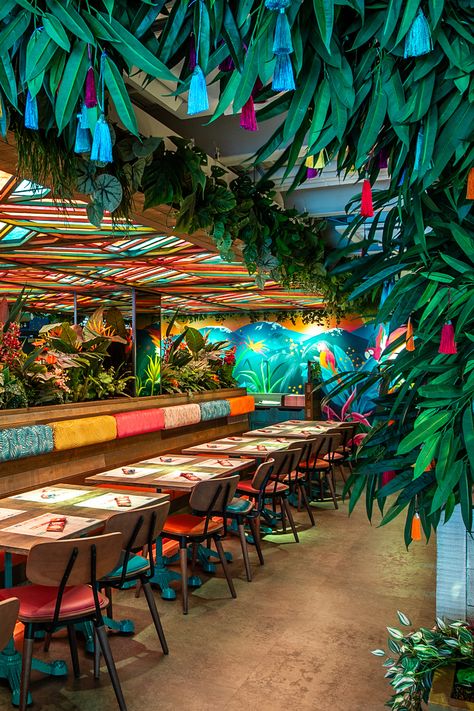 An Indian restaurant inspired by the tropical indian jungle rainforest. Jungle vibes restaurant. Funky restaurant. Green restaurant. Planting restaurant. Restaurant Interior Design Tropical, Jamaican Restaurant Decor, Modern Indian Restaurant Design, Acai Restaurant, Rainforest Cafe Aesthetic, Indian Restaurant Interior Design Creative, Restaurant Theme Ideas, Tropical Bar Design, Tropical Restaurant Design