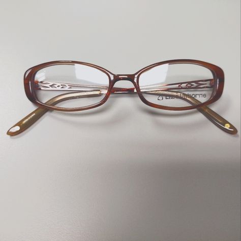 Vintage, Early Y2k Brown, Oval Plastic Eyeglass Frames With Demo Lenses. Metal, Detailed Cut Out Pattern On Temples With Brown, Plastic Temple Covers. Small Flaw In Demo Lens, But The Lenses Are Not Me At To Be Used For Wear. These Are Smaller Style Frame, Very Typical Of The Style Of The Early 2000s. New, Old Stock. Nostalgic Y2k Fashion. 2000s Genre. L227 Model Sk4 Color Brown Eye Width 50mm Eye Height 27mm Bridge 18mm Temple Length 135mm Glasses Thick Frames, Funky Eyeglasses For Women, Early 2000s Glasses, 90s Glasses Frames, Trendy Glasses Frames 2024, Browline Glasses Women, Rectangle Glasses Woman, Y2k Eyeglasses, Vintage Glasses Aesthetic