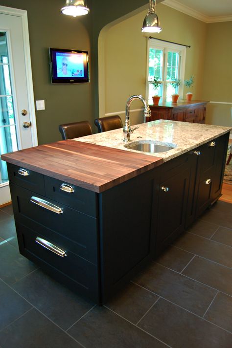 Walnut butcher block. Island with black painted cabinets and nickel cup pulls. Prep sink in Delicatus granite. Butcher Block Granite Combo, Butcher Block And Granite Island, Half Butcher Block Half Quartz, Tiled Kitchen Island Top, Black Island With Butcher Block, Granite And Butcher Block Countertops, Butcher Block And Granite Countertops, Black Butcher Block, Black Painted Cabinets