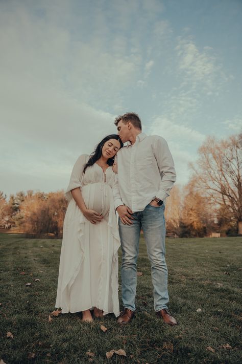 Maternity boho outdoor fall picture photography white dress outside couple Husband Outfit For Maternity Shoot, White Dress Maternity Shoot With Husband, White Dress Maternity Pictures, Maternity Photography White Dress, White Dress Maternity Shoot, Maternity Photography Casual, White Pregnancy Dress, Maternity Photography Fall, Fall Maternity Pictures