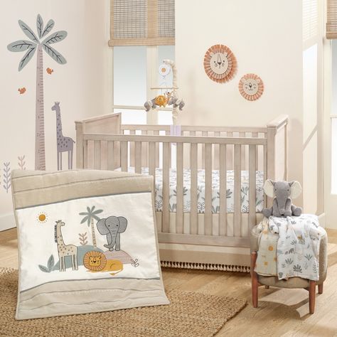 This stylized jungle three-piece crib bedding set will delight your little adventurer. The set includes one quilt, one breathable 100% cotton fitted crib sheet, and one decorative crib skirt. Made in a combination of linen, cotton, twill, jersey, faux suede, and velour fabrications. A majestic giraffe, a gentle heather gray jersey elephant, and a friendly lion made of faux suede are the centerpieces of this safari collection. Gray satin embroidery, a black and white mini checkered pattern inset, and rows of white bean stitches add to the charm. The breathable 100% cotton fitted crib sheet is on a clean white ground with elephants, lions, giraffes, and foliage. There is elastic all the way around ensuring a safe and secure fit on a standard-sized crib mattress measuring approximately 28” X Mini Crib Bedding, Adventure Wall, Lambs & Ivy, Baby Crib Bedding Sets, Welcome Home Baby, Toddler Bed Set, Crib Skirt, Jungle Adventure, Baby Crib Bedding