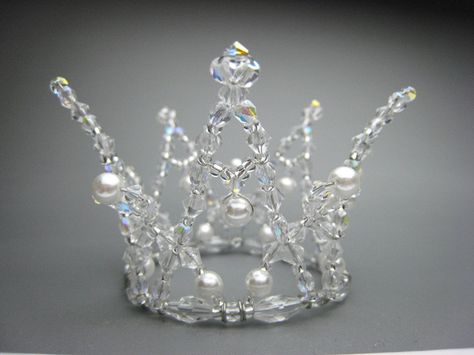 This fantastic tiara can be used for the role of the white swan in Swan lake, but also for the Snow Queen in Nutcracker, Snow Maiden and many other classical roles. Entirely hand made on a silver frame and decorated with white pearls. Ships in 2 to 4 weeks. Price: $ 150.00 Ballet Tiaras, Ballet Headpieces, Wire Crown, Swan Lake Ballet, Handmade Tiaras, The Snow Queen, Snow Maiden, Tiara Headpieces, Ballet Bag