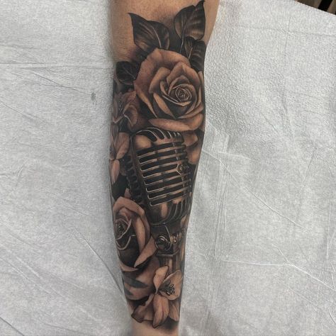 🎙️Microphone and Rose 🌹by @sash_tattoo Sasha's books are closed! Keep an eye on her page for when they reopen Call 5875204653 #microphonetattoo #vintagemicrophone #rose #rosetattoo #blackandgreytattoo #blackandgreytattoos #neotraditionaltattoo #neotraditional #neorealism #neotraditionalcanada #yeg #yegtattoo #yegtattoos #yegtattooshop #yegtattooartist #yeglocal #yegsmallbusiness #yeggers #shoplocalyeg #yegbusiness #yeglife #blackgoldtattooco #BGTC #crimsonempiretattoo #crimsonempire #CET Rose And Microphone Tattoo, Music Sleeve Tattoo Women, Music Sleeve Tattoo, Music Tattoo Designs Men, Microphone Tattoo, Arm Tattoos Black, Music Tattoo Sleeves, Empire Tattoo, Father Tattoos