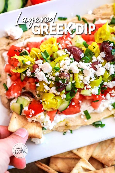 This is THE BEST DIP RECIPE EVER! This easy layered greek dip is quick to make, requires no cooking, and people rave about it every time it is served. It is kind of like a seven layer greek dip where all of the ingredients are layered on top of each other to form a fresh, healthy party dip perfect for an appetizer or neighborhood BBQ. Serve this easy greek layer dip with fresh pita or chips. Layered Greek Dip, Greek Dip Recipes, Greek Flatbread, Party Appetizer Dips, Greek Layer Dip, Best Dip, Best Dip Recipes, Layered Dip Recipes, Greek Dip