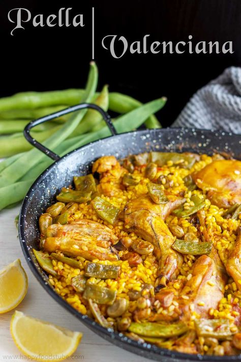 Paella Valenciana. Traditional Paella Valenciana is a great dish to share with family and friends! http://www.happyfoodstube.com/paella-valenciana #paella #valencia #spanish #food Foods From Spain Traditional, Paella Recipe Authentic, Spanish Rice Dish, Valenciana Recipe, Valencia Paella, Traditional Paella, Easy Paella, Traditional Spanish Recipes, Spanish Paella