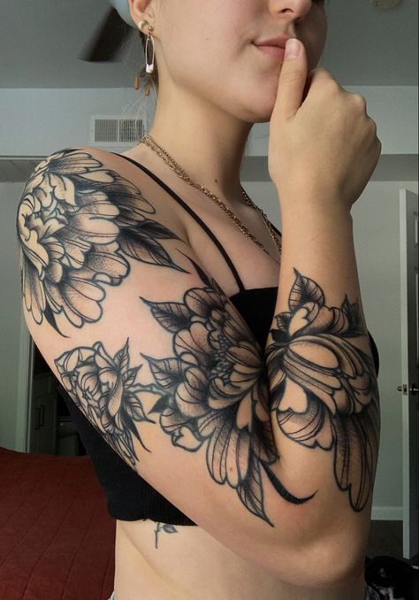 peony sleeve tattoo Peony Arm Sleeve Tattoo, Dark Floral Shoulder Tattoo, Dark Floral Sleeve Tattoos For Women, Large Floral Cover Up Tattoo, Matching Shoulder Tattoos For Women, Black Work Shoulder Tattoo, Large Peony Tattoo, Edgy Floral Tattoo, Botanical Shoulder Cap Tattoo