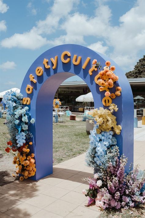 Taking inspiration from the iconic Coachella festival, we brought the party to Sydney's Centennial Park⁠⁠. 250 guests for lunch with huge hanging tassel installations & rainbow coloured flowers & stationary. ⁠⁠Outside we built a branded archway, quirky furniture, colourful palm trees and giant letters. We set up an Aperol Spritz bar, make up station, beer tasting, a pet farm, a Bucking Bronco, a psychic, caricaturist, a DJ, and many more... ⁠⁠ #eventstyling #christmasparty #activation Quirky Furniture, Event Entrance, Giant Letters, Coachella Inspiration, Project Portfolio, Event Props, Backdrop Design, Entrance Decor, Event Inspiration