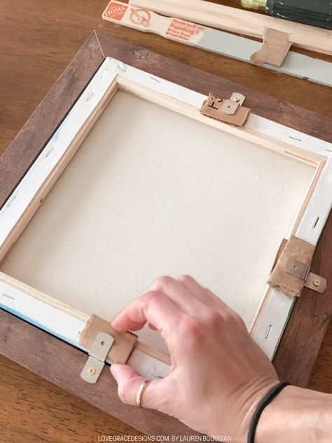 How To Frame a Canvas with a Normal Picture Frame | Love, Grace Making A Frame For A Canvas, Make A Frame For Canvas, Diy Canvas Picture Frame, Framing A Canvas Picture, Frame A Canvas Diy, How To Frame Canvas Art Easy Diy, How To Hang Paintings On Wall, Framing A Canvas Painting, Frame Canvas Diy