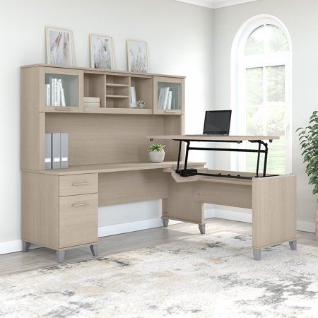 The Bush Furniture Somerset 72W 3 Position Sit to Stand L Shaped Desk with Hutch offers an ideal solution for those seeking a stylish and functional ergonomic workspace. As a quality alternative to desktop risers, the innovative 42W x 24D Sit to Stand Return offers all the health benefits of a standing desk with the versatility of more expensive electric height adjustable options. The built-in mechanical Lift-n-Lock system allows the desktop to lock into place at standing heights of 35, 38, and L Shaped Desk With Hutch, Desk With Hutch, Frosted Glass Door, Sit To Stand, Desk Hutch, Office Set, Bush Furniture, L Shaped Desk, Desk Set