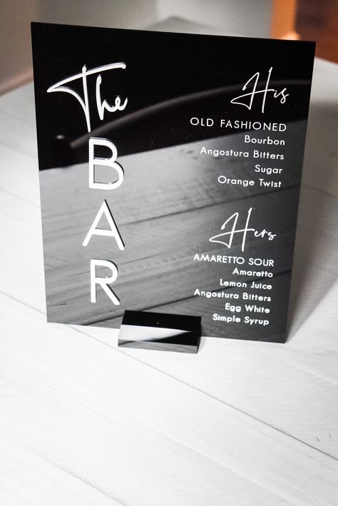 This bar sign is perfect for your modern wedding or event.  The sign is 8" x 10" acrylic, with your choice of gold mirror, rose gold mirror, silver, black or white lettering for 'The Bar' (drink headings i.e 'Signature Drinks' will match colour selected)  Sign colours available: Frosted: menu text body will be in white  Black: menu text body will be in white  White: menu text body will be black  Dimensions: 8" x 10" x 0.1" 20.2 cm x 25.4 cm x 0.3 cm Each sign comes with a stand. Please note that Black And White Signature Drink Sign, His And Hers Wedding Drinks, Wedding Signage Black And White, Black White And Gold Wedding Theme, Wedding Menu Board, His And Her Drinks Wedding Bar Signs, Bar Events Ideas, Black And White Wedding Theme Decor, His And Her Drinks Wedding