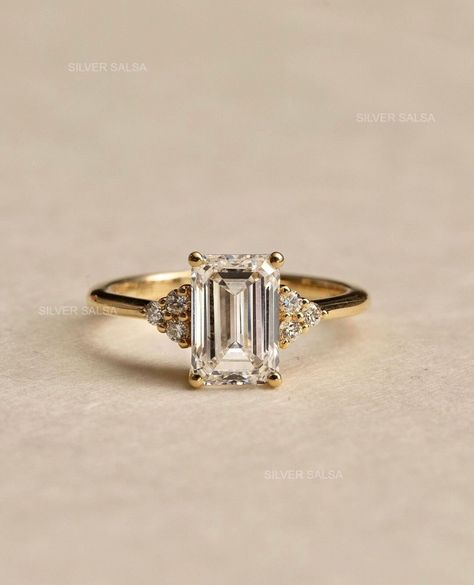 Cluster Set Emerald Moissanite Wedding Ring 2 Carat Anniversary Ring Vintage Ring Accent Diamond Ring Yellow Gold Ring Art Deco Ring for Her I Moissanite Ring | Diamond Ring | Gifts for Mom | Cluster Ring I  ✥ YOUR PURCHASE WILL INCLUDE ↣ Free Shipping ↣ Free Ring Sizing ↣ Free Ring Box ↣ Free Gift Box Wrapping ↣ Free Engraving ↣ 100% Satisfaction ●  Stone Details → Shape: Emerald Cut Moissanite → Size: 2.0 CT → Color: Colorless → Clarity: VVS → Measurement: 6*8 MM (apps) → Luster: Excellent → M Deco Wedding Ring, Art Deco Wedding Set, Vintage Emerald Cut Engagement Rings, Art Deco Wedding Ring Set, Vintage Emerald Cut Cluster Ring With Center Stone, Emerald Cut Gold Ring, Vintage Emerald Cut Cluster Ring, Gold Heirloom Cluster Ring With Emerald Cut, Classic Emerald Cut Moissanite Cluster Ring