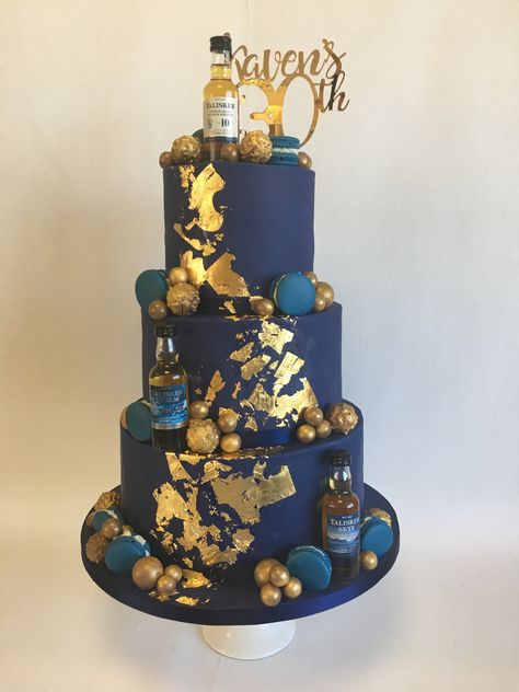 3 tier Navy 30th birthday cake with edible gold leaf, macarons and gold chocolate decorations Navy Blue And Gold Birthday Cake For Men, Modern 18th Birthday Cake, 40th Birthday Ideas For Men Blue And Gold, Navy Gold Birthday Party, 3 Tier Cake For Men, 18th Birthday Cake 3 Tier, Navy Blue And Gold Cake For Men, Navy And Gold Birthday Cake, Navy Blue And Gold Birthday Decorations