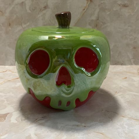 Disney: Snow White Poison Apple Cookie Jar From The Villains Division. This Is A Beautiful Ceramic Cookie Jar With A Iridescent Green Glaze With A Red Background Shape Like A Apple With A Wicked Face . Measurements: Circumference 22 1/2”, 6” High , 6 “ Across, 5” Depth. Sorry Due To Weight Of Product This Can’t Be Bundled. Skull Pinch Pot, Marvel Ceramics Ideas, Mexican Piggy Bank, Ceramics Lidded Jar, Pottery Cookie Jar, Nonfunctional Ceramics, Disney Clay Art, Food Sculpture Clay, Ceramic Christmas Gifts