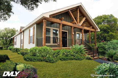 Pensacola, Florida–based Sanders Housing partners with Deer Valley Homebuilders and Mossy Oak to construct their nature-inspired series of four modular homes. This three-bedroom, two-bathroom home has exposed wood beams on the interior and exterior and rustic wood finishes throughout. Deer Valley Homes, Vinyl Window Trim, Interior Door Knobs, Prefab Home, Unique Floor Plans, Fibreglass Roof, Roof Trusses, Deer Valley, Mobil Home