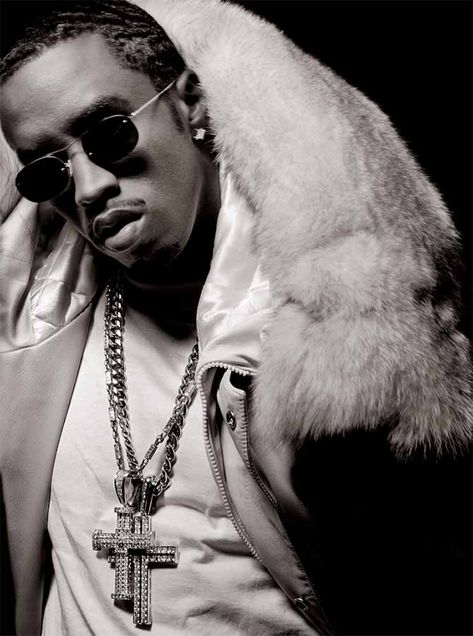 Sean Combs also known as Puff Daddy, P. Diddy, Diddy, or Love wearing a pair of diamond and platinum crosses, an enduring symbol in hip-hop jewelry, on a Cuban link and chain resembling a rolo or Saturn/rosary chain with diamond accents. Photo Albert Watson, New York, 1999 Why Ice Cold Is So Hot | The Adventurine Michaela Bercu, Gabrielle Reece, Record Label Logo, Albert Watson, History Of Hip Hop, Sean Combs, Are You Not Entertained, Hip Hop Chains, Gordon Parks